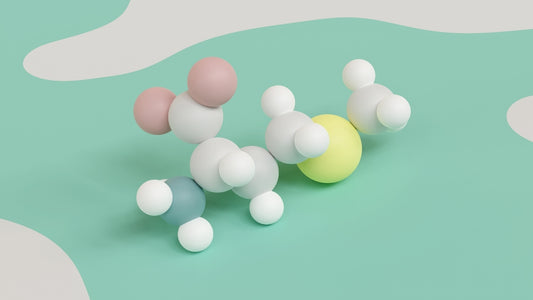 En modell i hvit, rosa og gul som viser en aminosyre-oppbygning